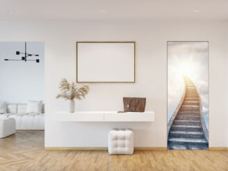 A white entrance hallway with a blank horizontal poster above a cabinet with the pampas grass in a vase, a pouf on a parquet floor, two doors, a doorway to the living room with a white sofa. 3d render, Stairway leading up to bright light