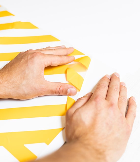 peeling yellow stripe wallpaper